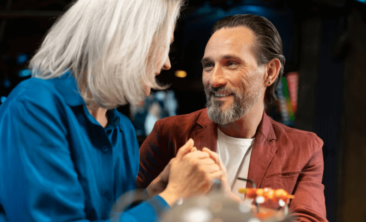 Senior couple sharing conversation in a warm indoor setting