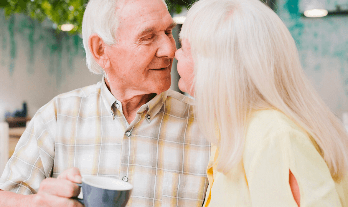 Older couple sharing a close conversation indoors